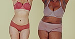 Dance, body and women in underwear for inclusion in studio isolated on a green background. Positivity, friends in lingerie and diversity, beauty of different plus size people together and acceptance