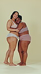 Body positive, diversity and women happiness, hug and embrace for acceptance, inclusion and solidarity respect. Woman empowerment portrait, lingerie size or curvy friends hugging on studio background