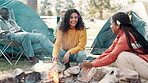 Friends, happy and camping fire in nature, smile group and holiday or vacation with conversation. Bonfire, adventure and bonding together in outdoor, relax and campsite for warm or picnic in park