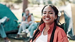 Woman, face and happy in nature for camper, smile and holiday or getaway with friends. Vacation, adventure and camping chair, park and outdoor or eco friendly travel in forest for spring break