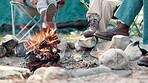 Friends, feet and camping fire in nature, group and holiday or vacation with bonfire in designated area for adventure. Bonding, together and outdoor, relax and campsite for warm or picnic in park