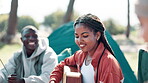 Woman, friends and camping in nature or singing, smile and holiday or getaway with for peace with guitar. Vacation, adventure and camper, music and outdoor fun or relax on travel for spring break