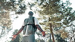 Hiking, black man and freedom in forest for calm, relaxing and fresh air on vacation outdoor with smile. Adventure, journey or holiday in nature for wellness, breathing and male camper in countryside