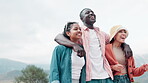 Friends, walking and diversity with outdoor sky, embrace and smile for bonding and care on vacation or holiday. People, summer and travelling for fun, laughing and together with support and nature