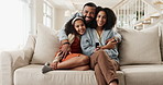Hug, smile and watching tv with family on sofa in living room of home together for streaming. Happy, love or portrait with parents and girl child embracing in apartment for television entertainment