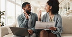 Happy couple, laptop and documents with high five on sofa for achievement, financial freedom or investment at home. Excited man and woman touching on computer with paperwork for insurance at house
