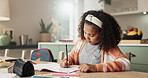 Girl, math homework and book in kitchen for learn with child development or responsible for growth. Time management, critical thinking and initiative with discipline or learning for school with book.