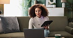 Woman, home and tablet on sofa with laptop for social media or online ebook or networking for fun. Lady, living room and internet or mobile app for entertainment, communication and post with reading