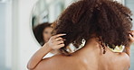 Mirror, check and woman with afro, haircare and back view of person, confidence and results of treatment. Natural beauty, glow and shine of hair, home and model with hairstyle from salon in apartment