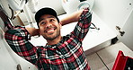 Happy man, plumber and relax with sink for repair, maintenance done with fix or service at home. Young male person, handyman or finished with tools on faucet, basin or leakage in bathroom at house