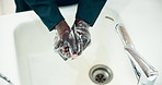 Black person, hands and washing with soap above by sink for hygiene, disinfection or sanitizing in bathroom. Top view or closeup of African or janitor cleaning for bacteria or germ removal by faucet