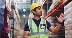 Man, construction and talking in engineer in warehouse, planning and conversation with architect for factory expansion. Professional, employee and industrial business with people, helmet and safety
