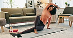 Online yoga class, tablet and woman in apartment, on floor of living room for fitness, health or wellness. Exercise, stretching and tech with person in home for holistic training, pilates or zen