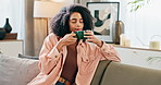 Black woman, relax and drinking coffee with aroma for caffeine, hot beverage or latte on sofa at home. Calm African or female person with smile or enjoying morning, cappuccino or warm scent at house