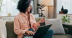 Woman, credit card and laptop in living room on sofa, fintech and online transaction for shopping in home. Customer, internet payment and sale app or banking, e commerce and excited for purchase