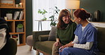 Senior, woman and caregiver with laughing or talking for support, funny conversation and kindness in nursing home. Elderly, person and nurse with comic story, compassion and understanding in homecare