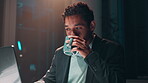 Night, coffee and businessman on laptop for programming, software project or web design in office. Research, drinking tea or programmer coding in overtime for cybersecurity network on system database