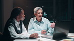 Business people, laptop and audit discussion in office at night for overtime accounting meeting. Corporate team, accountant and auditors with tech for financial report, erp and budget plan deadline