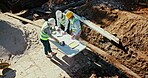Architecture, blueprint and collaboration with construction worker people from above. Development, industry and project management with mature architect team outdoor for building site planning
