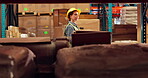 Logistics, woman and walking with tablet in warehouse in helmet for safety in supply chain or freight. Female person, industry and quality control in packaging, shipping or stock management of goods