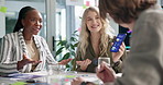 Business people, meeting and presentation with phone screen for app, software development or innovation at office. Group of employees in team discussion for UI, interaction or UX on mobile smartphone