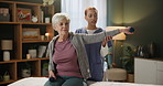 Recovery, physiotherapist and senior woman with dumbbell in gym for physiotherapy, healthcare or workout. Support, nurse and elderly patient in clinic for help, arthritis training or rehabilitation