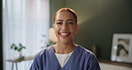 Smile, nurse and face of woman in living room for healthcare, medical support or trust in nursing home. Wellness, portrait and caregiver in scrubs for confidence, happiness or volunteer service