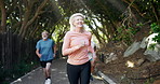 Nature, running club and mature people with health, wellness and body workout at outdoor park. Fitness, sports and group of senior athletes with cardio exercise on path in field for marathon training