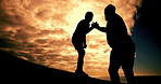 Happy, people and silhouette with sunset sky background and clouds for collaboration, peace and freedom. Friends, shadow and handshake together for support, help and bonding on hike adventure