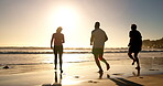 Friends, people and running at beach with fun for holiday, break and trip for summer in Brazil. Sunset, vacation and happy in seaside for tour with adventure, destination and smile for bonding