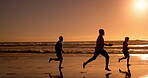 Ocean, sunset and silhouette of people with running on sand for trust, fun and vacation together. Waves, nature and friends with energy at beach for outdoor travel, adventure and holiday in Cancun