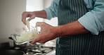 Pot, hands or man in kitchen cooking healthy food for recipe nutrition, vegan diet or dinner in home. Hot stove, wellness and closeup of person with bowl in lunch preparation for meal or onion dish