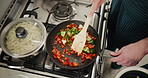 Hands, frying and cooking with home, kitchen and stir for food or nutrition with diet. Person, vegetables and peppers for lunch, dinner or meal with pan and ingredients for seasoning for preparation