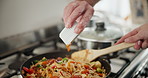 Hands, sauce and cooking with pan, kitchen and frying for food or nutrition with diet. Person, vegetables and peppers for lunch, dinner or meal with home and ingredients for seasoning for preparation