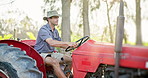 Tractor, farmer and man drive at farm greenhouse for harvest, growth and vegetable production business. Agriculture, machine and person in vehicle for plant cultivation, food and working at garden