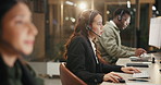 Business people, consultant and night with computer at call center, customer service or support at office. Group of employees, agency or agent working late in consulting or telemarketing at workplace