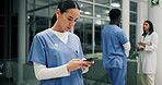 Nurse, smartphone and typing in hospital for healthcare, telehealth and medical results or prescription. Woman, mobile and chat at work for health, wellness and research on medicine or patient care