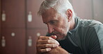 Locker room, man and thinking with pensive thoughts, contemplating and planning with ideas. Senior person, sports coach and solution for training, performance and game strategy in gym center