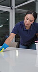 Woman, spray and bottle for cleaning at office with gloves, protection or detergent for hygiene at night. Housekeeping service, product and safety with disinfection for bacteria risk of germs