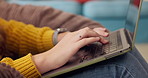 Hands, typing and woman in home with laptop, writing and communication on website for freelance career. Research, networking and girl in living room with remote work, email or computer for online job