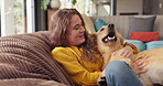 Woman, dog and pet in home for love, affection and trust or support in living room. Puppy, training and Golden retriever for adoption or rescue for animal, owner person and hug and canine best friend