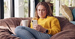 Girl, smartphone and relax with coffee in home in morning for social media, trending news and scroll internet for post. Woman, bean bag and online for comfort or rest, peace and text communication.