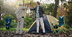 High five, man or dad camping in nature for family adventure, success or motivation with smile. Handshake, senior father or happy people in forest with gesture for support, teamwork or goals together