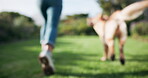 Play, dog and owner running outdoor in park for training, exercise and bonding in nature. Person, animal or pet together outside in backyard for fitness, health and workout or summer adventure blurry