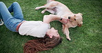 Happy woman, dog and play on grass for care, love or friends bonding together in top view outdoor. Animal, girl or pet owner with golden retriever at park on lawn to relax, smile or tickle game above