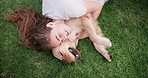 Happy woman, dog and hug on grass to relax, love or friends bonding together in top view outdoor. Animal, girl and pet owner with golden retriever at park for playing, kiss and stroke above in summer