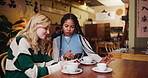 Friends, women and smartphone at cafe for coffee date or lunch with smile for bonding, support and care. Social media, happy and conversation at shop with tea on lunch or break to relax and enjoy