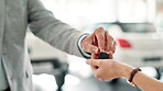 People, hands and keys for car in dealership, salesman and woman customer for successful purchase or test drive. Motor vehicle, showroom and rental with businessman, transport and automobile sale