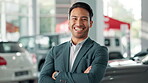 Arms crossed, car dealership and smile with face of salesman on showroom floor for bargain or deal. Finance, portrait and retail with happy vehicle trader in suit for consulting, service or transport
