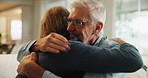 Senior father, son and hug on couch for support, love and happy bonding together in home. Relax, dad and adult child embrace on sofa with respect, care or comfort on weekend in living room with smile